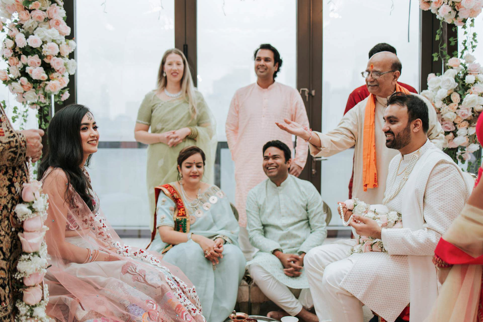 The bride and groom smile excitingly as they anticipate the upcoming events, while their friends and family sit behind them admiring. The Hyatt House was flooded with sunlight and joy. 